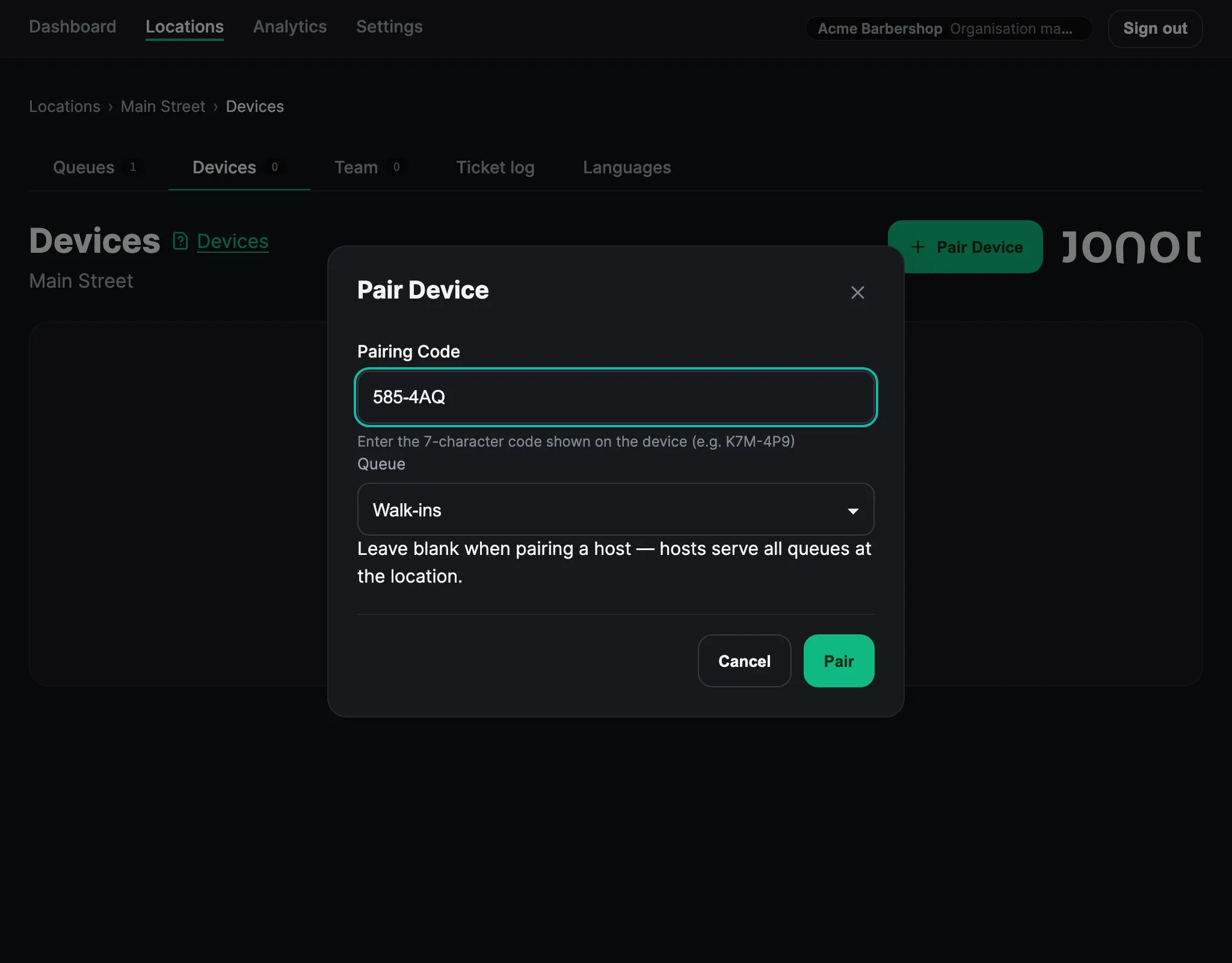 Pair device dialog in the Jonot admin dashboard with a pairing code entered and a queue selected